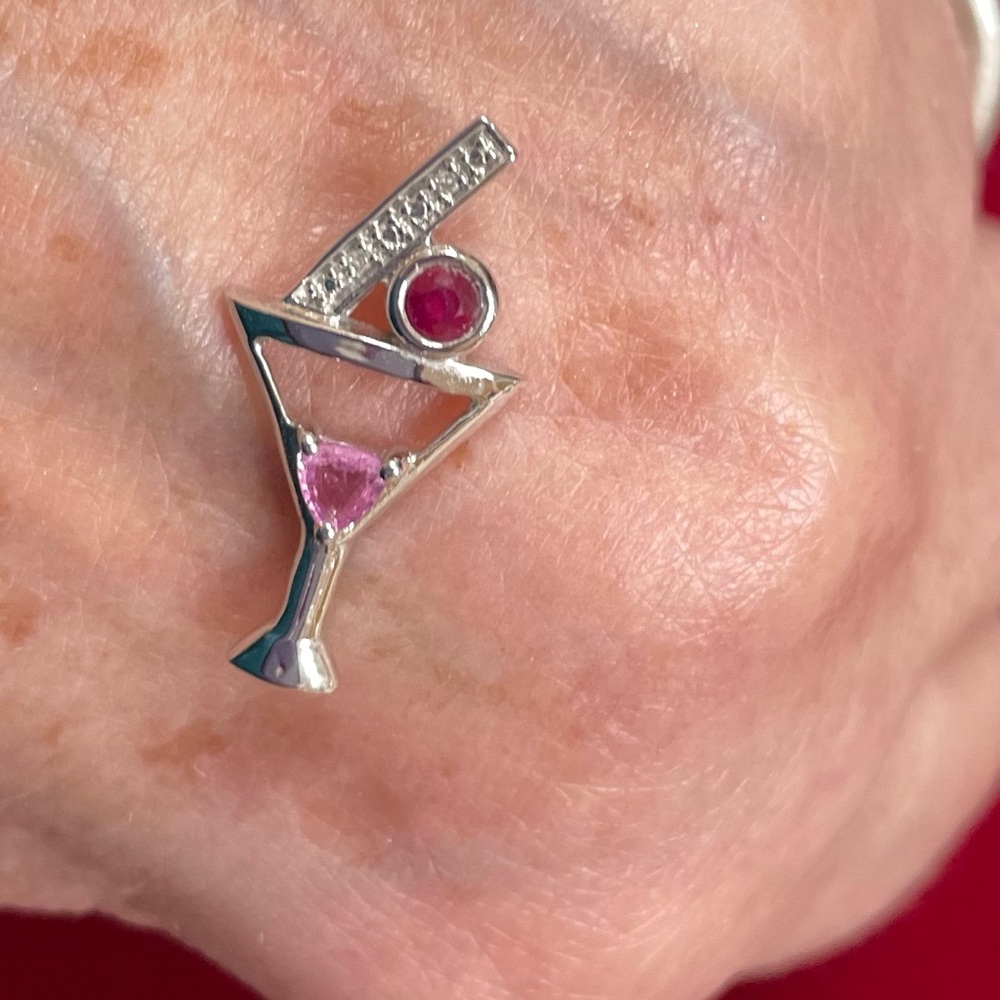 10k white gold pendant is set with a ruby & pink sapphire